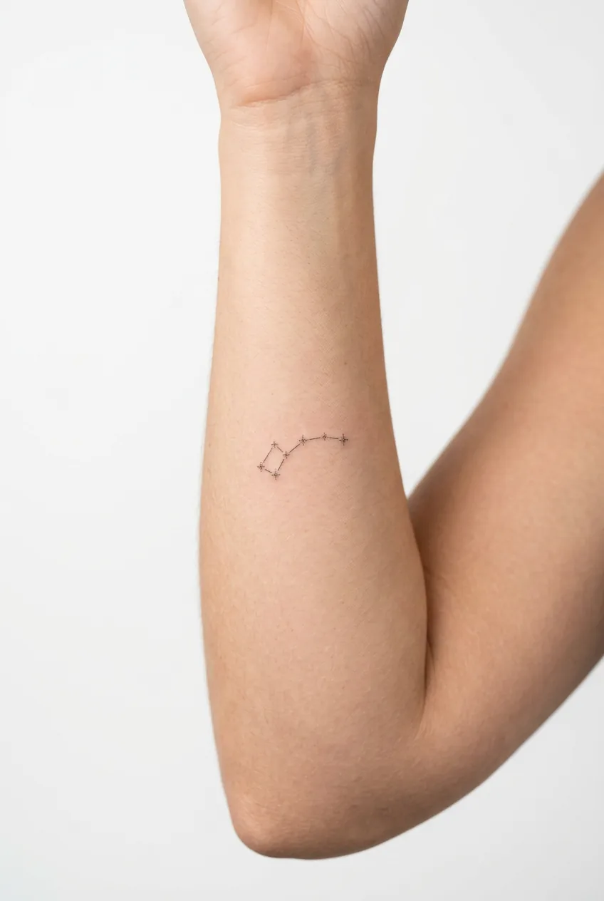 Tiny constellation tattoo with dot pattern on woman's inner forearm