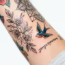 Collection of various tattoo styles including minimalist, boho, and bold designs displayed on skin