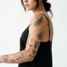 Collection of trending women's tattoo designs in 2026 showing various styles from botanical to geometric